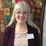Head shot of Delyth Balmer, who serves as the Administrator and Associate Minister at the Interfaith Center for Spiritual Growth in Ann Arbor.
